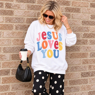 Close-up of the Jesus Loves You Christian crewneck sweatshirt in White with colorful retro lettering