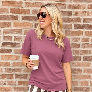 Woman wearing the Favorite Soft Solid Bella+Canvas Tee in Mauve with striped wide-leg pants