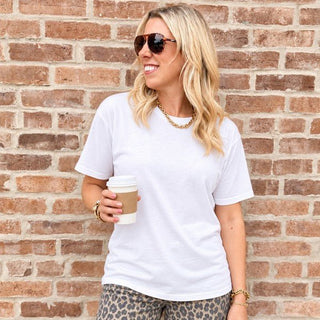 Woman wearing the Favorite Soft Solid Bella+Canvas Tee in White with leopard wide-leg pants
